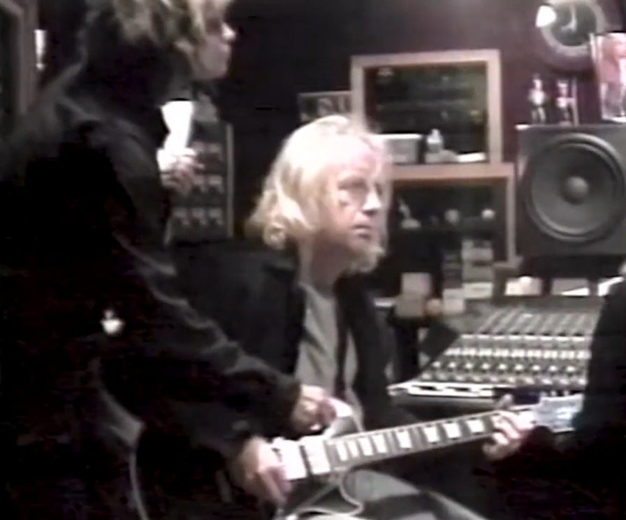 Brad Whitford playing guitar at the mixing desk