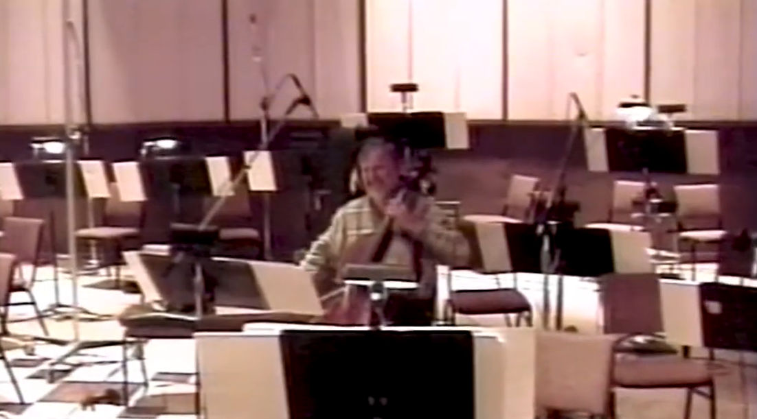 A cellist recording at a string session