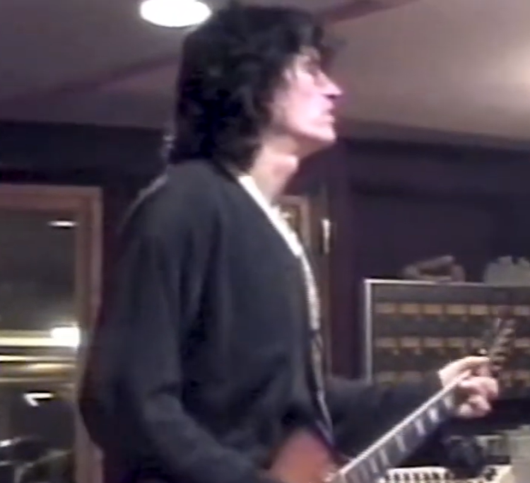 Joe Perry playing guitar in the studio